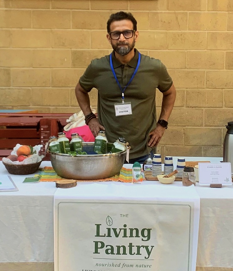 Mustafa Mohsin, Founder and Maker of The Living Pantry, with LP bottles in Karachi